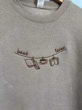 Load image into Gallery viewer, Book Lover Clothes Line Crewneck
